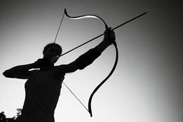 archer aiming bow and arrow
